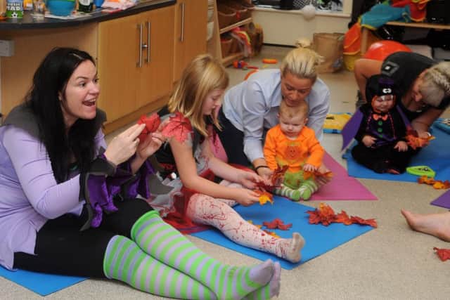 Nichola Caughey (l), of Baby Bunnies Yoga at a halloween themed yoga session at Epworth Children's Centre. Picture: Andrew Roe
