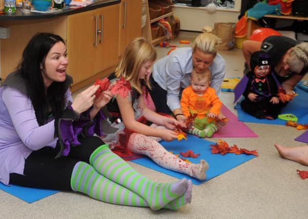 Nichola Caughey (l), of Baby Bunnies Yoga at a halloween themed yoga session at Epworth Children's Centre. Picture: Andrew Roe