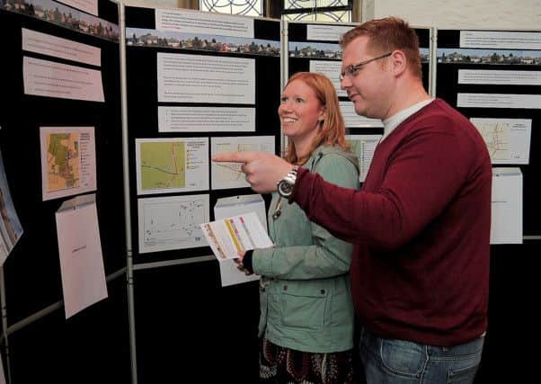 Villagers attending a 'Village Plan', Consultation at Newton on Trent, Lincolnshire.
Charles & Michelle Nicholls, Newton villagers, looking at the Village Plan proposals