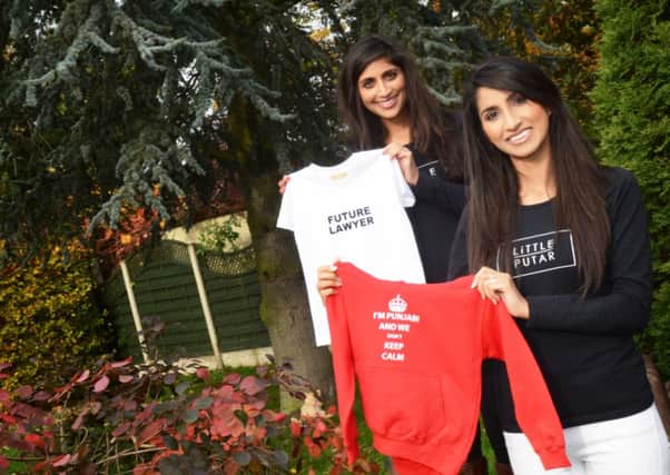 Sisters Rajveen Takhar, 26 and Harleen, 29, of Westwoodside, have set-up Little Putar babywear a quirky Punjabi clothing collection which features funny Punjabi slogans, phrases and surnames. Picture: Marie Caley D5728MC