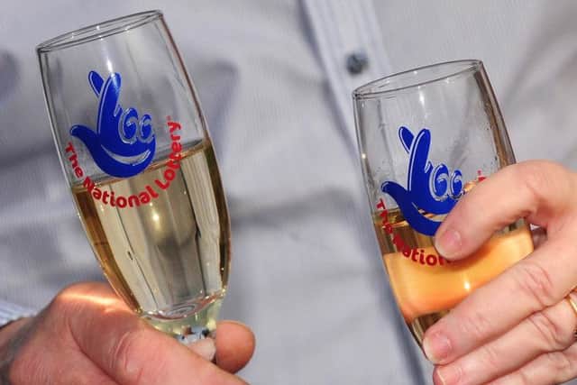 National Lottery champagne flutes as the Lottery will mark two decades of creating millionaires and supporting good causes when it whirs up its draw machine and brightly coloured balls today.Photo: Rui Vieira/PA Wire