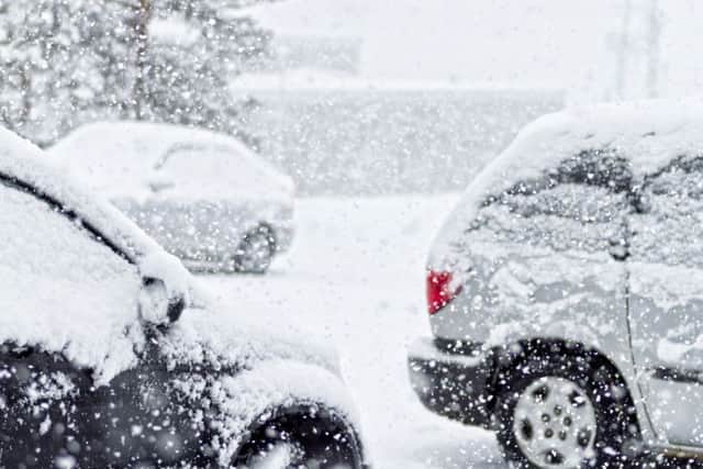 Cars in a snow storm.
