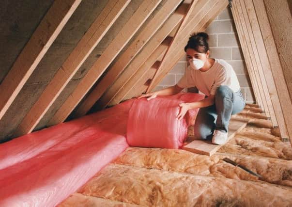 Undated Handout Photo of someone insulating the roof.  See PA Feature LIFESTYLE DIY. PA Photo/B&Q. / loft insulation