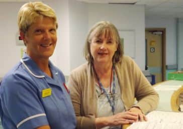 Discussing a patient with nurse Lorrie Cross (left) is lead palliative care practitioner Dr Ann Morris.