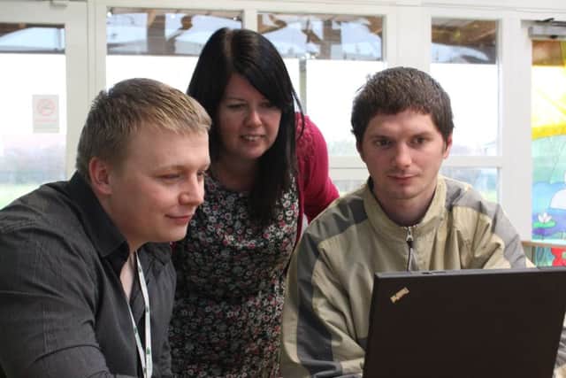 WLDC digital champion Luke Russell and Claire White, early years manager at GAPA help jobseeker Sean OMara online