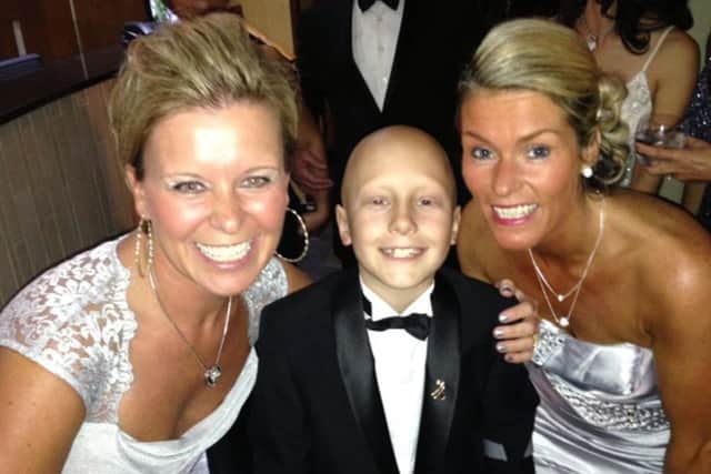 Ethan is pictured with his godmother, Dawn Foulston and his mum, Sam Maull