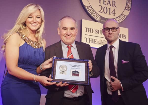 Auction House Founding Director Roger Lake (centre) receiving Sliver Award for Best Franchise from Michelle Mone (Founder of Ultimo) and Ben Greco (MovewithUs Group)