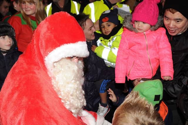 Santa talks to the children at the Epworth Christmas Lights Switch On. Picture: Andrew Roe