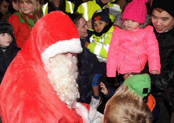 Santa talks to the children at the Epworth Christmas Lights Switch On. Picture: Andrew Roe