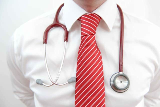 File photo dated 25/01/13 of a model posing with a stethoscope, as the Prime Minister announced that millions of patients are going to be able to see their family doctors outside of work hours thanks to a new fund to extend GP opening times. PRESS ASSOCIATION Photo. Issue date: Monday April 14, 2014. David Cameron said that more than 7.5 million people will be offered increased access to their GP services through extended opening times and new consultation methods using video-phone services, email and phone. See PA story HEALTH Hours. Photo credit should read: Andrew Matthews/PA Wire