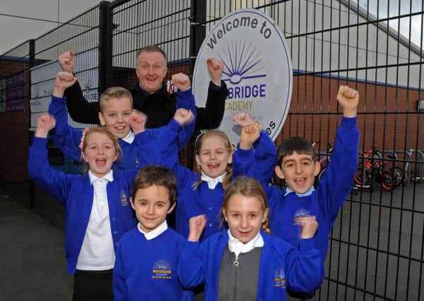 Headteacher George Huthart and pupils from Norbridge Academy, Worksop celebrate on achieving an outstanding Ofsted report. Picture: Andrew Roe