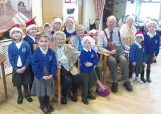 Pupils from Benjamin Adlard School sang carols to residents at Foxby Court Nursing Home
