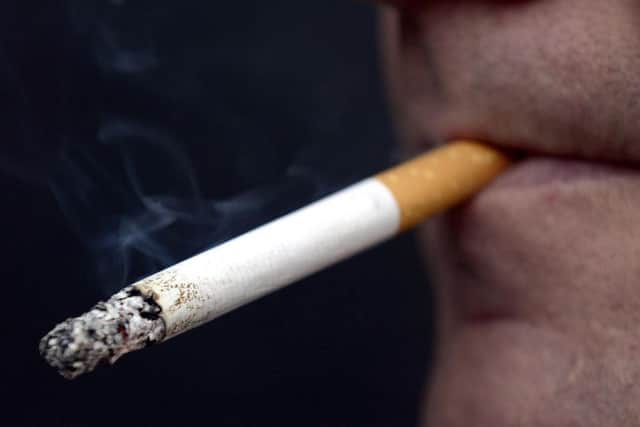 Picture of a man smoking.