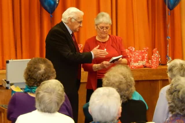 Mistertons senior citizens annual party - pictured is the magician with assistant Hazel Duffner, Chair of the Ladies Group.