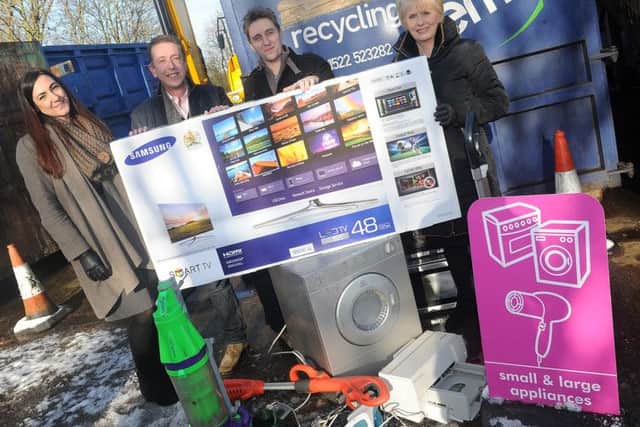 (l-r) Alyce Morris, of Repic, Cllr David Robinson and Cllr Liz Redfern present Tony Borman, of Epworth with a television at Belton Household Recycling Centre for winning a recycling award. Picture: Andrew Roe