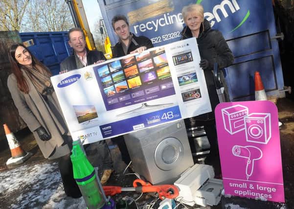 (l-r) Alyce Morris, of Repic, Cllr David Robinson and Cllr Liz Redfern present Tony Borman, of Epworth with a television at Belton Household Recycling Centre for winning a recycling award. Picture: Andrew Roe