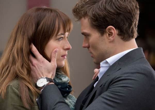 Fifty Shades of Grey starring Dakota Johnson as Anastasia "Ana" Steele and Jamie Dornan as Christian Grey.