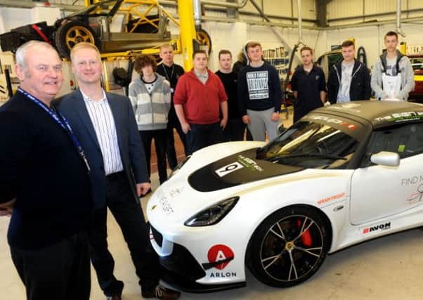 Kev Gibbon, left, lecturer in automotive engineering at Gainsborough College, welcomes special guest Rob Boston, second left, to their workshops where he gave talks and demonstrations to students on their enrichment week about his involvement with the Lotus Cup Uk race.