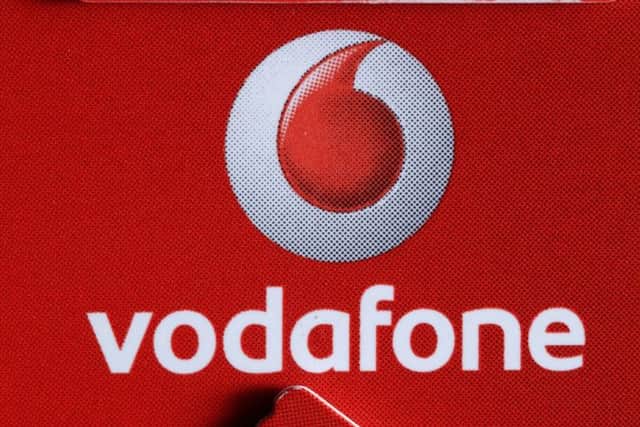 Picture by Gabriel Szabo/Guzelian
Vodafone sim card in Bradford, West Yorkshire
Strength in market heavyweight Vodafone, following a broker upgrade, and in other defensive stocks helped leading share index notch modest gains in thin Wednesday trade as investors positioned themselves ahead of the Budget.
Vodafone, up 1.1 percent, accounted for more than half of the FTSE 100 .FTSE index's points gain as Goldman Sachs upgraded the mobile phone operator to its "conviction buy" list.