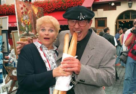 Mike Reid and screen wife Pam St. Clement filming episodes of EastEnders in Paris, 27/08/1993. See PA Feature BOOK St Clement. Picture credit should read: Tim Ockenden/PA Photos. WARNING: This picture must only be used to accompany PA Feature BOOK St Clement.