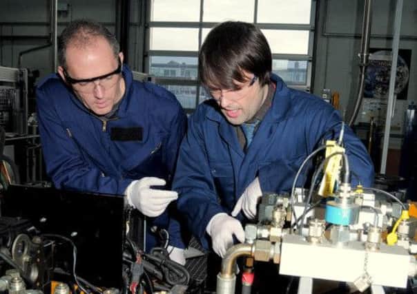 Industry Day at the Fluid Power centre Worksop. NWGU 18-2-15 Fluid, Centre Student Pete Bryant(left) with Lecturer Aaran Teasel