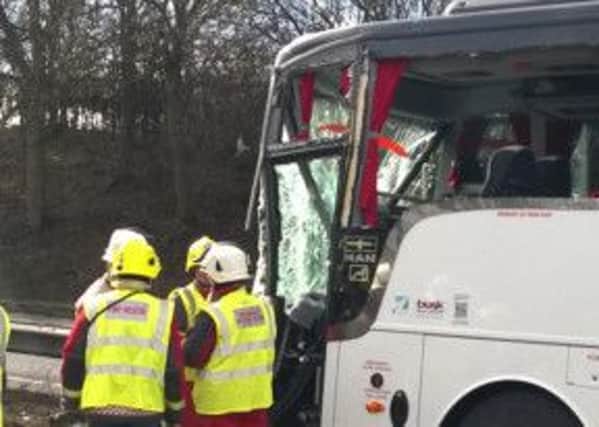 Firefighters freed 33 people from a coach today after it collided with a lorry on the A1. Photo from @nottsfire.