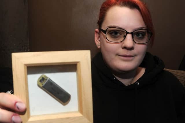 Sara Brautigam, of Kirk Sandall holds up an implantable loop recorder as she has a rare illness that causes her heart to stop beating and she is wanting to raise awareness of the condition. Picture: Andrew Roe