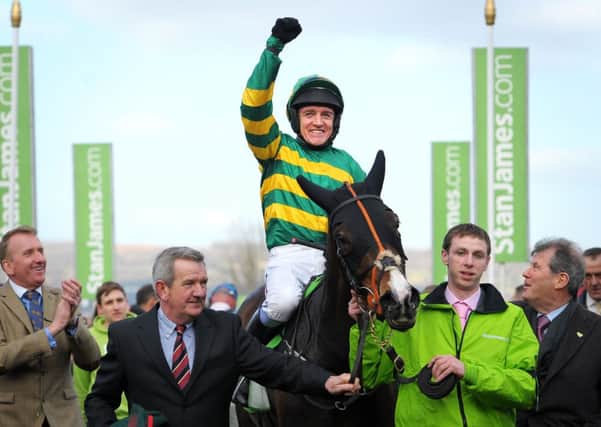 CHAMPION! -- jockey Barry Geraghty salutes the crowds after steering Jezki home in last year's Stan James Champion Hurdle (PHOTO BY: Tim Ireland/PA Wire).
