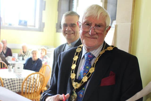 Chair of West Lindsey District Council, Coun Malcolm Parish cuts the ribbon at the Community Café with the Reverend Canon Michael Cooney, Priest in Charge of the Parish of Gainsborough and Morton at All Saints Church, Gainsborough.