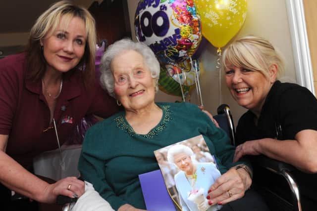 Fay Jones, of Waterside Grange Care Home, Dinnington is celebrating her 100th birthday, with Lizzie Rennocks (l), Senior Activity Co-ordinator and Maureen Veveris, care assistant. Picture: Andrew Roe