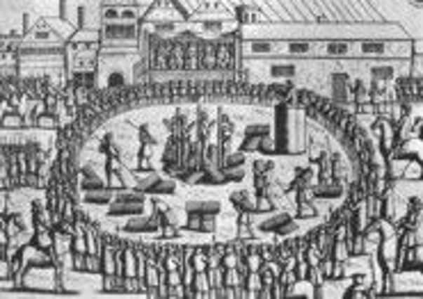 A print taken from a wooden carving of the burning of Anne Askew and John Lassells