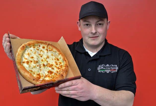 The Little Italy Pizza Co opened on Corringham Road, pictured is James Broderick with free garlic bread for Gainsborough Standard readers