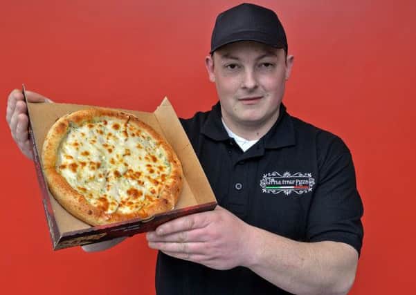 The Little Italy Pizza Co opened on Corringham Road, pictured is James Broderick with free garlic bread for Gainsborough Standard readers