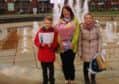 Adele Markham receiving her prizes won by her children Hollie and Joel Markham.