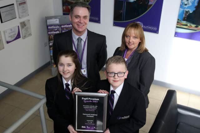 Students and pupils at Outwood Academy Portland with the Pupils Premier Award 2015. Pictured are pupils Tia Lewis, 11, and Oliver Oakes, Associate Executive Principal Dr Philip Smith, and Tracey Allport.