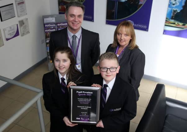 Students and pupils at Outwood Academy Portland with the Pupils Premier Award 2015. Pictured are pupils Tia Lewis, 11, and Oliver Oakes, Associate Executive Principal Dr Philip Smith, and Tracey Allport.