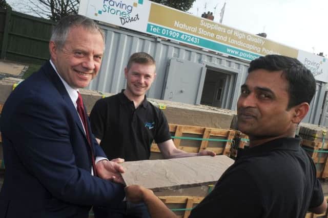 Ajay Adla, right, and Tom Raisbeck, the co-owners of Paving Stones Direct share their business success story with Bassetlaw MP John Mann when he visited their Turner Road yard on Friday.