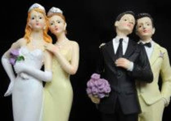 PARIS, FRANCE - APRIL 27:  Plastic figurines of same-sex couples are displayed at the gay marriage show on April 27, 2013 in Paris, France. The show takes place four days after France legalised same-sex marriage at the National Assembly.
(Photo by Antoine Antoniol/Getty Images)
