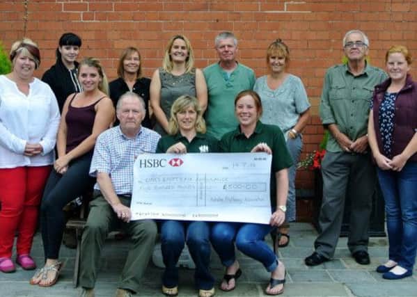 Axholme Bridleways Association members presenting a £500 cheque to Notts/Lincs Air Ambulance after a sponsored event last year.