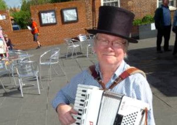 Crowle Market.  Accordionist Hugh Barwell from London entertains the shoppers.  Picture: Malcolm Billingham