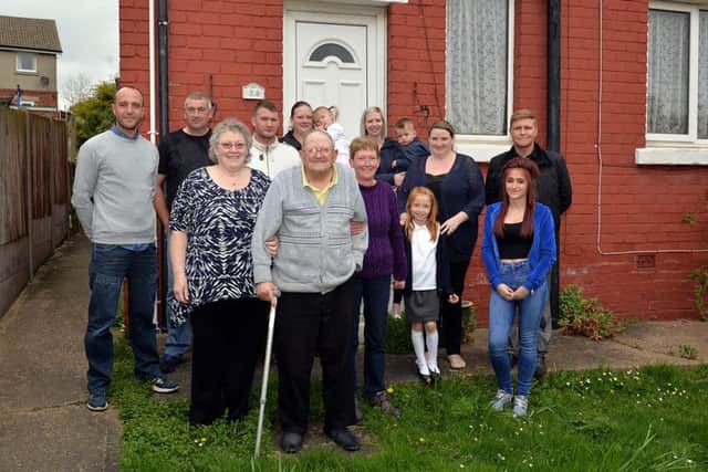 Celebrating the safe return of Les (Golly) Cluroe, pictured are some of the friends and family who were out looking for him