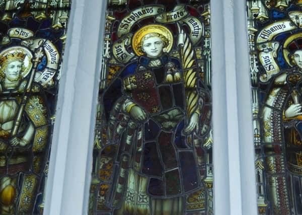 The memorial window at All Saints' Church, Misterton, which shows St Oswald (the saintly king of Northumbria), St Stephen (the first Christian martyr), and St Alban (the first British Christian martyr)