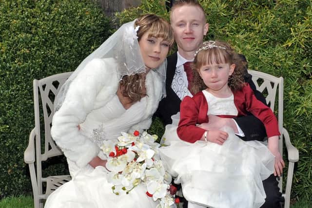 Wedding of Leanna Cox and William Boulton at Newstead Abbey, pictured are the bride and groom with daughter Kelsa