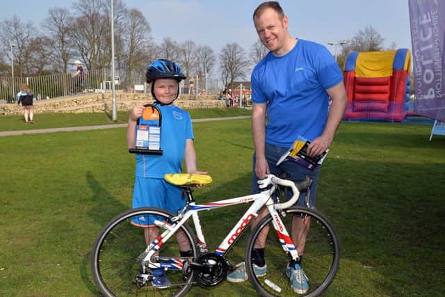 Free bike MOT and anti theft marking with the Police and Fire Service at The Canch, pictured is Kiegan Wright, seven with Dad Steve