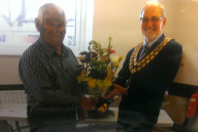John Bassindale being congratulated by the mayor of Crowle Town Council Ron Stewart for winning Crowle and Ealand Over 60s Social Club's flower arrangement competition.