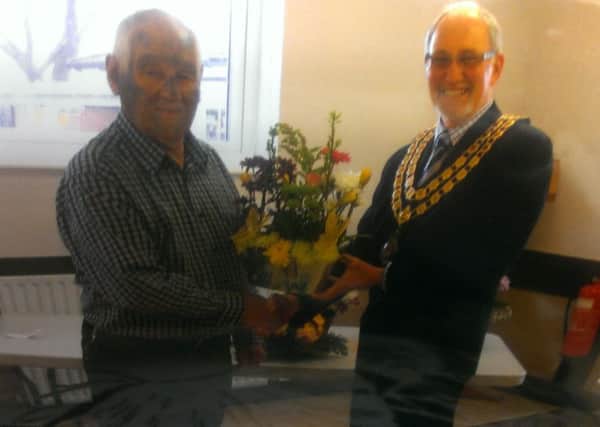 John Bassindale being congratulated by the mayor of Crowle Town Council Ron Stewart for winning Crowle and Ealand Over 60s Social Club's flower arrangement competition.