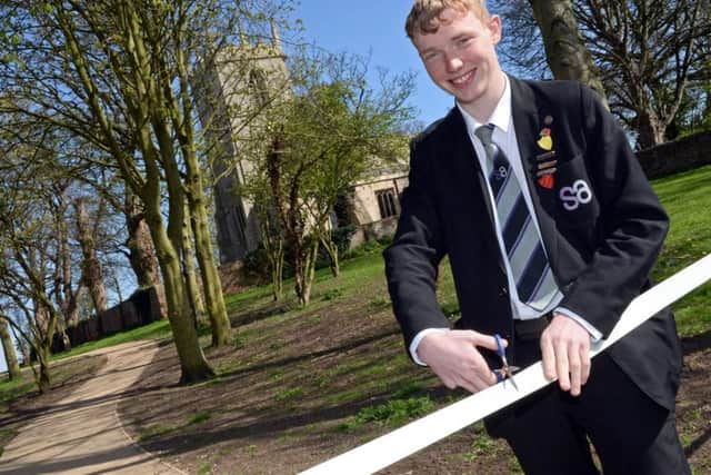 Ben Hellewell, 16, South Axholme Academy Head boy, officially opens the new path at King's Head Croft playing fields. Picture: Marie Caley NEPB 17-04-15 King's Head Croft MC 1
