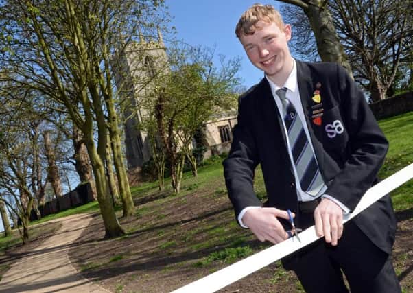 Ben Hellewell, 16, South Axholme Academy Head boy, officially opens the new path at King's Head Croft playing fields. Picture: Marie Caley NEPB 17-04-15 King's Head Croft MC 1