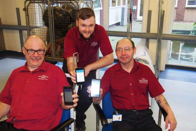 Porters David Riley, Sam Coulson, and David Farre swith the new technology