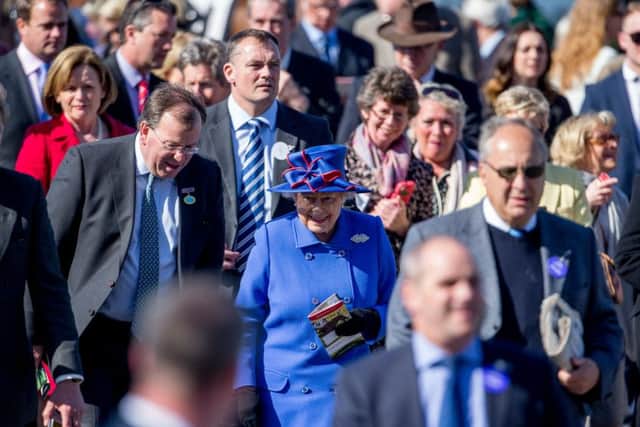 ROYAL APPROVAL -- the Queen mixes with the crowds at Newbury's Greenham meeting. Her two-year-old filly, Ring Of Truth, is one of our early-season horses to follow. (PHOTO BY: Steve Parsons/PA Wire).